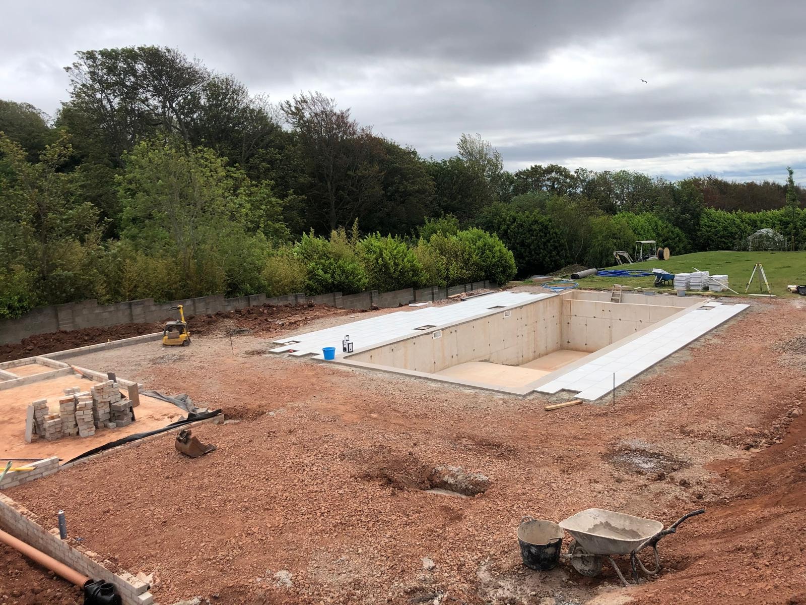 Swimming pool site preparation and construction work