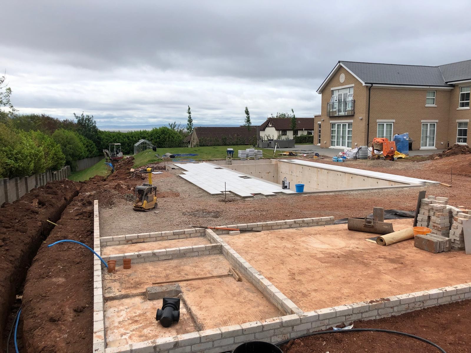 Swimming pool groundworks project progress on site