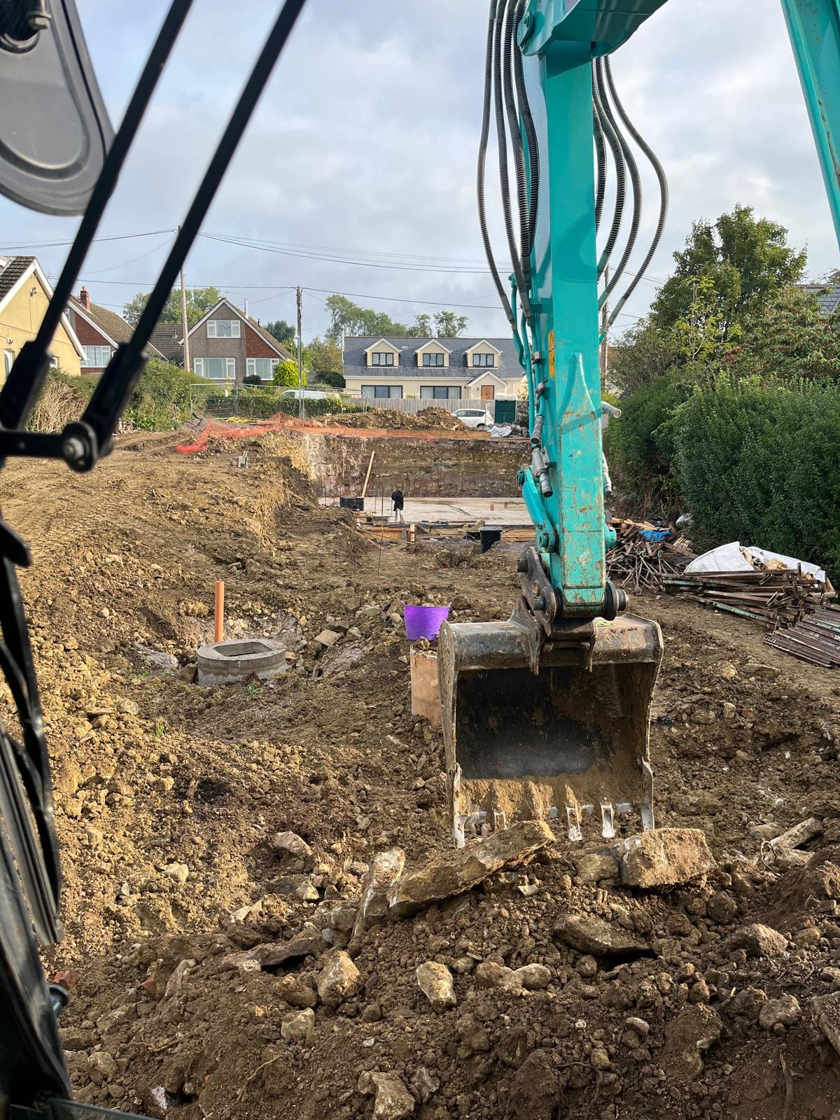 Excavator working on a Cowbridge groundworks project