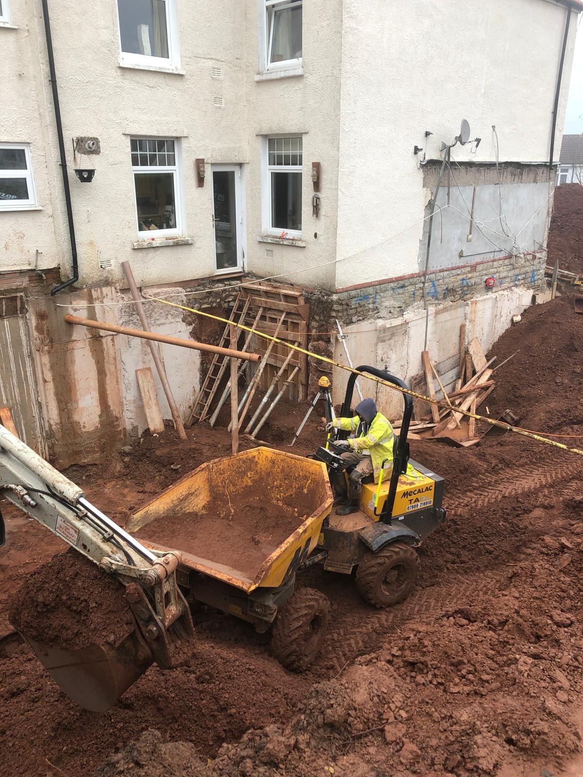 Excavator work during an underpinning project